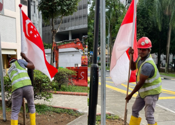 “Just doing my duty, Madam” – Migrant Worker fixes fallen Singapore Flag at Haig Road